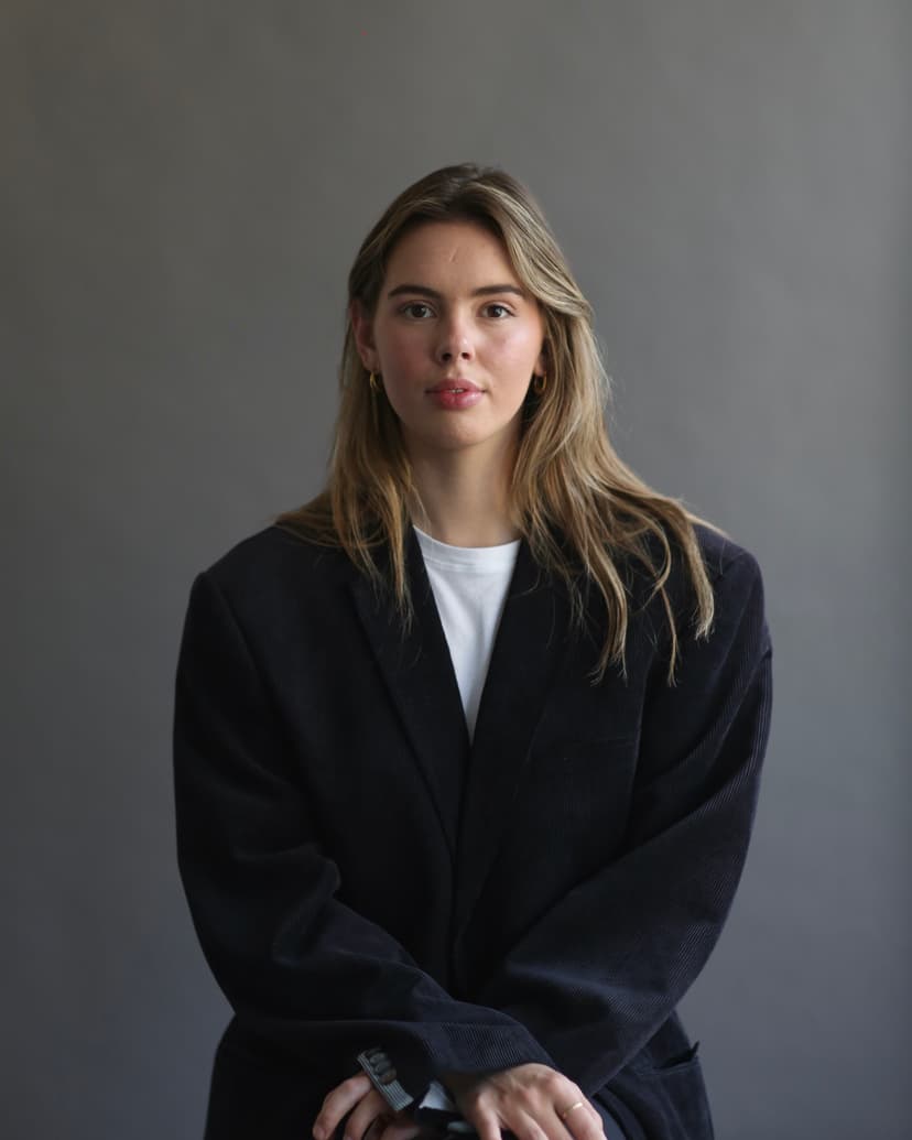 Model wearing women's black cotton crewneck tee.